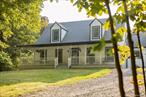 Set down a long private drive, this classic cape cod style home offers exceptional privacy on a 5 acre wooded lot within a beautiful residential pocket just 15 minutes from Rhinebeck Village. A true retreat, the property offers multiple outdoor areas of enjoyment including a large heated, gunite pool, rear deck, front porch, and expansive lawn.Wide plank pine wood floors flow throughout the renovated home, adding warmth and character. The main living area features wood-beamed ceilings and a wood-burning fireplace next to the grand dining room with 28 ft. cathedral ceilings - perfect for intimate dinners or entertaining. The bright walk-through kitchen opens directly to the pergola covered rear deck overlooking a large 20x40â€™ gunite pool with expansive hardscaping - an ideal setting for summer days.There is a spacious first-floor primary suite while two more generous bedrooms and a full bath are found upstairs. On the other side of the house with a separate staircase is a large family room - a flexible space to meet other needs such as a home office, play room or guest room. At the base of this staircase is another full bathroom and connection to the attached 2-car garage. The full basement with built-in work benches offers plenty of workspace and areas for storage.Thoughtfully updated, the home includes a generator, fresh exterior paint, new roof (2023), and updated central air (2025). Set on a quiet dead-end road the property offers exceptional privacy. Well-suited as a full-time residence, weekend home or investment property, there is so much potential. Within the Rhinebeck School District in the municipality of Stanford, the home has been an active Airbnb rental. For those seeking more space or investment potential, the adjacent property at 21 Pine Knoll is also available for sale by the same owners â€” offering the opportunity to create a larger compound. All just under 2 hours from NYC.