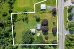 1.96 acres on Route 55 next to Dollar General. Currently has a 2 bedroom 1 bath single family, 2 machine sheds and a pole barn with double garage door and heat. Great Rental opportunity. Level Land with C-2 Zoning for multiple uses. Zoning code attached.