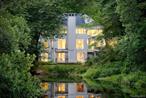 Tucked beside a peaceful pond in Pound Ridge, this contemporary retreat feels like living inside a work of art. Expansive floor-to-ceiling windows create a striking photo effect, framing dramatic rock outcroppings and serene water views like living photographs. Inside, the modern kitchen features island seating and open flow for easy entertaining. The three bedrooms and three and a half baths offer a perfect blend of comfort and style, with spaces that flow effortlessly toward the outdoors. Step onto the stunning decks and youâ€™re greeted by sweeping water views and a front-row seat to the ever-changing theater of local wildlifeâ€”herons gliding, turtles sunning, deer wandering. Enjoy the outdoors with an inviting fire pit, or take an easy stroll to nearby walking paths, downtown Pound Ridge-Scotts Corners or the Town Park in just minutes. Every inch of this home has been meticulously cared for, with generous space for two dedicated work-from-home offices plus a separate family TV room, making it as practical as it is inviting. Come see for yourself!