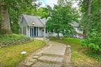Charming 4 Bedroom, 1.5 Bath Rollingwood Split tucked up on almost a half acre that offers peace and privacy. Updated eat in kitchen with wood cabinetry, quartz countertops and bright dining area, living room with wood burning fireplace, cozy family room, hardwood floors throughout, walk up attic for excellent storage or possible expansion, Anderson windows, vinyl siding, Leaf-guard gutters, enormous two tiered deck with built in seating for outdoor entertainment, newly covered paved patio, in-ground sprinklers, one car garage, wide driveway and pretty curb appeal, low taxes and ready for immediate occupancy. Located in a desirable development with a gated feel and yet super convenient to everything you need