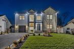 Stunning, modern farmhouse style new construction home in highly desired Salisbury! Still time to customize ! 5 bedrooms, 7 bathrooms! Fully finished basement with outside entrance! Stucco/masonry exterior! Grand, 2 story high entry foyer with modern tower stairs leading to the second floor, wide plank European white oak floors, custom accent wall designs, quartz countertop and quartz backsplash in the kitchen, LED under cabinet and under counter top lighting! Full, large bedroom/office space on the first floor with en-suite bathroom! Second floor features 4 bathrooms, every bedroom has its own private bathroom! Laundry room on a second floor! Highlight of this house is a primary bedroom with vaulted ceilings, large walk in closet and stunning primary bathroom with a soaking tub, shower and double Vanities! Second floor also features large loft area, that could be used an upstairs living room! THIS HOME COMES WITH NATURAL GAS, ONE OF VERY FEW HOUSES IN SALISBURY WITH NATURAL GAS! Few of many upgrades include: Spray foam insulation, wiring for TV cable and internet in every bedroom, surround speaker system in family room and primary bedroom, wiring for exterior security cameras, tankless water heater, electric vehicle charger, all new sod and fence, 5 zone sprinkler system, paver patio and so much more! Fully finished, 1400 sq ft basement comes with a full bathroom! Plenty of space for home gym, bar or anything else you wish! Basement has outside entrance that gives easy access to the good size backyard, plenty of space to entertain your friends and family! This home has it all! PLEASE NOTE THIS HOME IS UNDER CONSTRUCTION! EXPECTED DELIVERY DATE IS FEBRUARY 2025! PICTURES ARE FROM THE OTHER PROJECTS BY THE SAME BUILDER AND ARE FOR DEMONSTRATION PURPOSES ONLY, ACTUAL FINISHES MAY VARY!