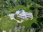 Nestled privately, and surrounded by matured trees, on 1.82 bucolic mid-country acres, sits this seven bedroom, seven full and three half bath, gorgeous estate! Extraordinary stone & shingle construction, built by Aberdeen Properties, and gardens magnificently designed by Rutherford & Associates. Dramatic front to back, double height entry, exquisite millwork throughout, 10â€™ ceilings, and a comfortable open flow. Ideal for both everyday living and grand scale entertaining! Fabulous primary suite, with sitting area, plus five other spacious ensuite bedrooms, and a separate guest suite. Gourmet kitchen with sun-filled breakfast area and large pantry, formal dining room, family room, living room and magnificent office/library that is privately located at the end of the first floor. Finished lower level with gym/extra ensuite bedroom, another family/hang out room, home theater & spectacular wine room. Outside is a private, resort like oasis, with a large flagstone patio, fire pit, pizza oven, jacuzzi and a magnificent pool, overlooking the gorgeous manicured lawn! Minutes to shops, five-star restaurants, beaches, parks, train and major highways for an easy commute to NYC. Luxury, comfort, privacy and convenienceâ€¦this one has it all!