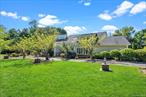 Set on a full acre at the end of a quiet cul-de-sac, this classic Colonial offers space, comfort, and privacy in desirable Roslyn Harbor. With 5 bedrooms and 3.5 bathrooms, the home features a first-floor primary suite, a sun-filled living room with vaulted ceilings, and a generous eat-in kitchen designed for both everyday living and entertaining. The backyard is a true retreat with a sparkling in-ground pool, expansive patio, and mature landscaping, ideal for relaxing or hosting gatherings. Located within the Roslyn School District and close to parks, shops, and transportation, this property combines convenience with a peaceful setting. Being sold as is, this home offers you the perfect opportunity to update, customize, and truly make it your own.
