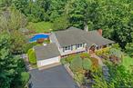Welcome to the highly sought-after Salem Ridge community, where every day feels like a vacation and luxury meets lifestyle. When you know, you know. This exceptional residence is nestled on a fully fenced, parklike acre and offers a private, country club-style backyard designed for both relaxation and entertainment. Enjoy a beautifully crafted in-ground pool, paved patios, a bocce ball court, and a covered porch that provides elevated views of your outdoor oasis. From the moment you arrive, you&rsquo;re welcomed by stunning masonry, a tranquil waterfall, and a charming, covered entryway that sets the tone for whatâ€™s inside. Step into a spacious living room anchored by a cozy fireplace, a formal dining room with elegant, coffered ceilings, and a bright, open-concept kitchen that flows seamlessly into the family room. High ceilings, a second fireplace, and sliding glass doors create a light-filled space that overlooks the porch and backyard, blending indoor and outdoor living with ease. Upstairs, the serene primary bedroom offers a private en-suite bath and peaceful views, accompanied by two additional generously sized bedrooms and a full bathroom. The lower level features a second family room with a third fireplace and oversized sliding doors that open to the backyard patio, along with a mudroom and an expansive storage and pantry area. Additional highlights include a finished basement with laundry and storage areas, updated electric service, two-zone central air conditioning, radiant heat with five thermostats, a fully wired sound system, and a generator-ready setup. Gleaming hardwood floors add warmth and sophistication to every space. Located within the award-winning Harborfields Blue Ribbon School District, this home offers the perfect blend of luxury, comfort, and resort-style living in one of the areaâ€™s most desirable neighborhoods.
