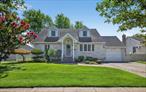 Beautiful and immaculate Expanded Cape situated mid-block in the heart of Bethpage, this four-bedroom, two full bath home offers incredible curb appeal and comfort. The spacious and sun-filled living room features a large bay window, creating the perfect space for both relaxing and entertaining. The updated kitchen shines with granite countertops, stylish backsplash, brand-new refrigerator, dishwasher, and wall oven, along with a convenient outside entrance for easy summer BBQs. A cozy family room with cathedral ceilings adds extra charm. The second floor boasts two dormered bedrooms and a full bath. The partially finished basement includes a brand-new washer/dryer, new hot water heater, cedar closet, and plenty of storage. Additional features include central air, 4-zone heating, sprinkler system, 16x16 deck, 10x15 shed, 2-car driveway, paver walkway, driveway, and stairs, all beautifully landscaped. Security System. The private fenced backyard is perfect for entertaining or simply unwinding outdoors. Oak floor under carpeting. Located in Bethpage School District #21, close to shopping, transportation, and the LIRR.