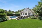 Tucked away on a quiet private cul-de-sac in the heart of Southampton Village, 63 Halsey Street is a masterclass in refined Hamptons living. This storybook home was completely reimagined in 2015â€”redone down to the studs with no detail overlooked. From the moment you arrive, its timeless charm is evident, with architectural Hardy board siding, a cedar shingle roof, and manicured landscaping that hints at the sophistication within.Step through the front door into a sun-filled space where every inch has been custom designed with elevated taste. The main level flows effortlessly between spaces, blending traditional details with modern ease. The gourmet kitchen features custom cabinetry, Wolf and Sub-Zero appliances, and a generous center island perfect for entertaining. Adjacent is a stylish dining area and cozy living room with a gas fireplaceâ€”all bathed in natural light and wired for integrated indoor-outdoor audio. Just beyond is a private den, perfect as a study or additional guest space.Offering four bedrooms and three full bathrooms, the home is thoughtfully laid out with two guest bedrooms on the first floor and two more upstairs, including a peaceful lofted space. A mudroom provides convenience after beach days, while custom finishes throughoutâ€”including Marvin Integrity windows and designer cabinetryâ€”elevate the interiors at every turn.Outside, the magic continues. Designed just two years ago by famed designer Vicente Wolf, the backyard is a secluded oasis anchored by a heated gunite pool, lush garden plantings, and a pergola-covered lounge area. A built-in gas fire pit, fed through town gas, creates the perfect evening ambiance. The detached garage, equipped with electric, provides added flexibility and storage.Whether hosting friends for a summer weekend or enjoying a quiet retreat year-round, 63 Halsey Street offers the ideal blend of design, comfort, and village convenienceâ€”all just moments to ocean beaches, shops, and restaurants. This is not just a houseâ€”itâ€™s your next chapter.