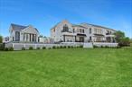 Welcome to 102 & 92 Dune Road, a uniquely designed 6, 000 Square foot home, nestled in the heart of Westhampton Beach. This architectural masterpiece boasts 6 bedrooms and 6 bathrooms, each offering panoramic views of the surrounding Atlantic Ocean & Bay through expansive walls of glass. This residence offers a wealth of features that cater to modern, comfortable living with its innovative design and serene setting. Boasting a floor-to-ceiling gas fireplace, creating a warm and inviting atmosphere for relaxation or entertainment. The heart of the home is an open-concept kitchen, a pioneer design by First Dunes construction, featuring Gaggenau appliances. The main floor also offers a flexible space that could serve as a den or a junior primary suite, depending on your needs. Moving outside, the property extends its luxurious offerings with a detached pool cabana, perfect for summer gatherings or peaceful afternoons. The infinity edge heated pool, complete with a spa, offers an idyllic setting for relaxation and entertainment. Replete with private floating dock & bay access. The location of this home is second to none, with easy access to the ocean and proximity to village shops and dock, providing a perfect blend of convenience and tranquility. Welcome home where innovation meets luxury, and comfort meets style.