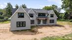 Luxury new construction in Muttontown  Welcome to 320 Circle Road. This home features over 7, 000 square feet of the highest quality and luxury finishes. Perfectly situated on 2.11 flat acres and located mid-block on a private street in the heart of Muttontown. No detail is overlooked including custom designed built ins, moldings and accent walls, wide plank hardwood floors and inset cabinetry. With 6 bedrooms and 7 bathrooms, 2 laundry rooms, and 10 foot high ceilings on every level this is a truly spectacular property.Through the double-height entry foyer, discover the custom built eat in chefâ€™s kitchen open to the oversized great room with a wall of windows, gas fireplace - perfect for entertaining and everyday living. The main floor features a junior primary suite, laundry room, formal dining room with butlerâ€™s pantry, walk-in pantry, custom mudroom, and living room. Upstairs, the primary suite is the epitome of luxury, with a large sitting area, a see-through fireplace, massive walk-in closets, and a custom designed primary bathroom. Also upstairs, there is a second laundry room, 3 oversized en-suite bedrooms with walk-in closets and a huge bonus room that could be used as an additional bedroom as well. *Still time to customize. Syosset Schools. Low Taxes. Approved plans for pool and spa.**Interior pictures are of the builder&rsquo;s past work as an example of the quality of design and finishes.