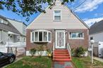 Charming Fully Detached 2-Bedroom Cape Cod with Spacious Yard.Welcome to this detached 2-bedroom, 1-bath Cape Cod home, offering classic charm and excellent potential. The main level features a bright living room with a large bay window, two comfortable bedrooms, a full bath, and hardwood floors preserved beneath the carpet.The full, partially finished basement with a separate entrance includes a dedicated laundry area and utility room ideal for storage, a workshop, or future recreation space. A full attic offers even more room for storage or potential expansion.Recent upgrades include a brand-new boiler and hot water heater, providing added comfort and peace of mind. Outside, enjoy a generously sized, fully fenced backyard perfect for entertaining, gardening, or simply relaxing in your own private space.Located on a quiet residential block with easy access to schools, shopping, and public transportation. A fantastic opportunity for first-time buyers, downsizers, or investors!