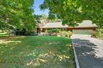 Sought after neighborhood centrally located in the Town of Somers waking distance to Intermediate & Middle Schools. This Cape style home offer spacious first level living w/primary bedroom on-suite and 2 additional bedrooms & a hall bath at one end of house, and an office and large den at the other end. Living room w/ decorative wood pegged flooring, formal dining room, large eat in kitchen w/bay window, complete first floor. Second level consists of bedroom, living area, a full bath and bonus room, once used as an apartment for family member. Huge walk-in attic accessible from 2nd floor finished area, leads across to 2nd staircase back down to garage. Future expansion possibilities or simply storage area. Attached two car garage has separate door to exterior and staircase to 2nd floor attic space. Tremendous finished basement ideal for recreation/game room with built in wet-bar and a half bath. In addition, there are two large rooms, a storage/utilities room and a laundry room with extra storage space. Oversized wood deck can accommodate large party entertaining. Perfectly level property for all your outdoor activities. Garden shed in yard.