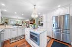 Welcome to this meticulously maintained and thoughtfully updated cape, offering the perfect blend of modern upgrades and timeless charm. Step inside to an inviting open-concept floor plan highlighted by a fully renovated kitchen (2023) featuring elegant cabinetry, Quartz counter tops, and top-of-the-line GE Cafe#233; Series appliances. All crystal chandeliers will remain with the home, adding a touch of sophistication throughout.The home showcases detailed custom woodworking around doors and entryways, creating warmth and character. The main living area flows seamlessly into a spacious 17x17 four-seasons room, complete with heat and A/C, perfect for year-round enjoyment. The main bathroom has been fully renovated and expanded, boasting luxurious Italian marble.Enjoy year-round comfort with new split A/C and heat units (2022) on both the main level and basement. The fully finished basement offers a versatile living space with a new full bathroom, a dedicated laundry room, and direct access to the garage.Step outside to a beautifully redone backyard (2019) designed for entertaining and relaxation. A new paver patio leads to a 15x30 semi-inground pool, complete with all necessary equipment for easy enjoyment.This stunning property truly has it allâ€”modern updates, elegant details, and spaces designed for both comfort and entertainment.
