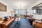 Welcome to this bright, high-floor corner one-bedroom co-op with a private terrace and sweeping views that stretch from Forest Hills Gardens to the Manhattan skyline. The spacious living room opens to a sunny outdoor escape, while the windowed kitchen features granite countertops, a dishwasher, and updated cabinetry. A large entry foyer offers generous closet space and a flexible nook for storage or work-from-home needs. The renovated bathroom includes mosaic tile and a sleek glass-enclosed tub for a clean, modern finish.The corner bedroom enjoys double exposures to the south and west, with custom wall-to-wall millwork adding warmth and character. Located in a solid, concrete, fireproof post-war building with a 24-hour doorman, laundry, bike storage, and ALL utilities included in the maintenance. Just around the corner from E/F express trains, the LIRR, and JFK-bound buses, and within easy reach of both Forest Hills Gardens and downtown Forest Hills â€” offering shops, dining, entertainment, and green space all within a few blocks. Cats welcome, no dogs.