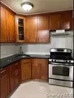Welcome to this spacious co-op at Elmhurst, offering approximately 800 sq. ft. of living space. Originally designed as a one-bedroom, the apartment has been thoughtfully reconfigured to provide three bedrooms, making it an ideal option for a growing household or for those in need of extra space for work or study. This well-maintained elevator building includes laundry facilities and is located in the heart of Elmhurst, close to Queens Center Mall, Target, Costco, supermarkets, and a variety of dining options. Commuting is convenient with nearby access to the M, R, E, and F trains as well as multiple bus lines. The building is pet-friendly, and subleasing is permitted subject to board approval