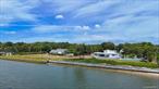 This is a truly special offering for the buyer who values both spectacular water views and limitless potential. Set on a massive 1.5-acre, south-facing lot drenched in sunlight, this property provides 209 feet of bulkheaded waterfront with direct private access to Shinnecock Bay. Whether you dream of expanding, renovating, rebuilding, or simply enjoying the home as it is, the possibilities here are endless.The existing 3-bedroom, 2.5-bath residence features an open-concept living, dining, and kitchen areaâ€”all designed to capture sweeping panoramic views. Expansive ceiling heights and walls of sliding glass doors invite the waterfront in from every angle, creating a seamless indoor-outdoor lifestyle. Step outside and launch your kayak or paddleboard into pristine bay waters, just beyond your backyard.With unobstructed views, unmatched access, and a rare oversized lot, this is an opportunity not to be missed by those who recognize true Hamptons waterfront value.