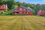 Discover 987 Hurd Road! A stunning 4-bedroom, 3-bath tri-level farmhouse where timeless charm meets modern comfort in the heart of Sullivan County. Set on 1.15 scenic acres with breathtaking mountain views, this 2, 350 sq. ft. retreat invites you to live, relax, and entertain in style. Inside, the open-concept design flows seamlessly across hardwood floors, with two cozy fireplaces and sun-drenched living spaces that feel warm and inviting. The chefâ€™s kitchen shines with stainless steel appliances, abundant cabinetry, and a built-in wet barâ€”perfect for gathering with family and friends. Unwind in the private primary suite featuring a spa-like soaking tub and spacious walk-in closet. Step outside to enjoy multiple outdoor living areas like the deck, patio, and porchâ€”all framed by peaceful views that change beautifully with every season. With central air, a one-car garage, and move-in-ready updates, this home checks every box. Just minutes from Bethel Woods, lakes, and hiking trails, itâ€™s the perfect escapeâ€”whether an airbnb investment or year-round living.
