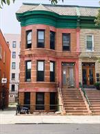 956 E 156th Street presents a prime investment opportunity with immediate rental income and strong upside potential. The property is configured as a legal three-family, with two units currently occupied and additional ground-floor rooms being rented, creating multiple income streams. Investors will also appreciate the added value of a garage, a rare amenity in the South Bronx that enhances both convenience and long-term appeal. Spanning over 3, 000 square feet, the home offers flexibility for restoration, reconfiguration, or modernization to maximize returns. Beyond its income potential, the property stands within the Longwood Historic District and was designed in the early 1900s by noted architect Warren C. Dickerson. Its Neo-Renaissance, Romanesque Revival design features a dramatic front stoop, bay windows, tall ceilings, and hardwood floors, blending historic charm with modern investment appeal. Sold as-is, 956 E 156th Street is a rare chance to own a piece of Bronx history while capitalizing on one of the boroughâ€™s most promising investment opportunities
