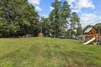 Being sold as a separate parcel, can also be purchased with the home at 3 Bedford Road as a package. This is a beautiful level lot just under .5 acres with an oversized shed, fire pit and swing set!