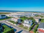 Beautifully renovated home in Atlantic Beach, just seconds from the beach! Featuring a spacious living room, modern kitchen with stainless steel appliances, 2 bedrooms, and 2 full bathrooms. The primary bedroom includes a private deck with stunning ocean views. Additional highlights include in-unit laundry, a backyard for outdoor living, plus a driveway and garage with parking for up to 4 cars. Available now!