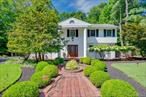 Welcome to this unique split-level home thoughtfully designed for both everyday living and easy entertaining. Set on a beautiful flat lot with mature plantings, this home combines comfort, light, and convenience in a highly desirable neighborhood. A beautiful herringbone brick walkway leads you to the front entry, where radiant heat keeps the space cozy in every season. Inside the heart of the house,  is a spacious family room addition with a gas fireplace and three walls of windows, creating a bright and welcoming gathering space.The eat-in kitchen offers abundant stone counter space, a Sub-Zero refrigerator and double ovens and opens directly into the family room so everyone stays connected . With 4 bedrooms there is plenty of room for family and guests. The primary suite feels like a retreat with its huge walk in closet , built-ins and spa-like bathroom featuring radiant heat , soaking tub and double vanities.The layout flows beautifully with multiple gathering spaces, including a library with custom built shelves, an open living room highlighted by a stunning mid century rosewood built-in and a large dining room that can easily seat up to 22 guests. Outdoors the private backyard retreat offers a generous patio, hot tub plus a grassy play area framed by lush landscaping . A whole house generator provides year round peace of mind. This home is designed for comfort and livability where every detail -from strategically placed radiant heat to built-in character adds warmth, style and ease. Pearl River Schools and only 26 miles into NYC.