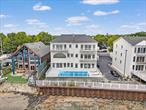 Waterfront Single-Family Condo - Over 7K SqFt of Modern Living - Private In-ground Pool This rare single-family, stand-alone condominium offers over 7, 000 square feet of modern living directly on the Long Island Sound. With 5 bedrooms and 3 bathrooms, the home is designed for both scale and comfort. Panoramic water views stretch from the Throggs Neck to the Whitestone Bridge, with every room capturing the scenery. Expansive balconies extend from each space, creating a seamless connection between indoors and out. Completely gut-renovated, the residence combines contemporary design with thoughtful detail. White oak floors flow throughout, complemented by marble flooring on the main level and soaring ceilings that amplify light and scale. The kitchen is outfitted with Bosch appliances, while radiant heated floors and a multi-zone central air system ensure year-round comfort. Private amenities include a two-car garage, an in-ground pool with a dedicated mechanical room, and a gated community setting. The lower level features its own separate entrance, adding flexibility for guests or extended living. The owner is also open to customizing walk-in closets to suit individual needs, offering an additional layer of personalization. Situated in the peaceful Throggs Neck section of the Bronx, 4 Angelas Place offers a balance of neighborhood charm and convenience. Nearby grocery stores like Super Food Town and Lizzie&rsquo;s Supermarket make daily shopping easy, while Ferry Point Park and Bicentennial Veterans Memorial Park provide ample green space, waterfront views, and recreation. Transportation is accessible with local bus routes Bx40 and Bx42 along East Tremont Avenue, express service to Midtown on the BxM9, connections to the 6 subway line, and the NYC Ferry for a scenic commute. Common charges are $1, 060.06.Some photos have been virtually staged.