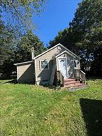 cape with amazing potential The layout includes 2 bedrooms, 1 bathroom, plus a bonus den perfect for a home office or extra space. The property also features a 2-car detached garage. Ideal for investors or buyers looking to take on a project with a head start and add value. property, NEW ROOF, NEW SIDING, NEW WINDOWS, NEW DOORS