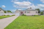 Cozy ranch in the heart of Farmingdale featuring 3 bedrooms and 2 full bathrooms. Highlights include hardwood floors, newer windows, newer boiler, and solar panels for energy efficiency. The home also offers a full finished basement with outside entrance.