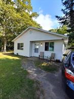 Great starter home! Maintenance free exterior on quiet tree lined street with private yard and cozy front porch to watch sun rise and set! Large living room, large kitchen. Lots of windows make it bright and airy! Big double hung living room window. Needs some TLC , major components good it&rsquo;s fully livable and it&rsquo;s new owner can take their time creating the home of your dreams! Newly paved street, close to new spray park, beach, marinas and ferry! Near LIRR, major roadways and all shopping LOW TAXES!!! With STAR approx $5786.23 verify all info supplied. Sold as is, seller makes no representations