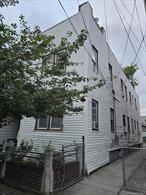 Semi-attached 2 family home located in the heart of Richmond Hill. Close to shopping, schools, JFK airport.