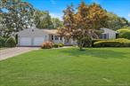 Welcome to this charming 4 Bedroom 2 full Bath Expanded Ranch, mid block location in Sayville. Step inside the welcoming entry foyer and feel instantly at home. The formal living room offers a gracious space for gatherings, flowing easily into the formal dining room, perfect for memorable dinners and celebrations. The eat-in kitchen, with its granite countertops, stainless steel appliances and pantry, is both functional and inviting, ideal for causal breakfasts or holiday feasts. The den is filled with natural light from three solar tubes and wall of south facing windows and also offers a cozy retreat, while the wood-burning fireplace with stove insert promises warmth and comfort on chilly winter days. The primary bedroom features its own private bath, complemented by three additional bedrooms to accommodate family, guests, or a home office. Set on .46 acres of mature, landscaped property, this home blends spaciousness with charm. With a large living room and kitchen as the heart of the home, three heat zones, central air, Anderson windows, hardwood floors, a deep two-car garage and full basement with interior/exterior access, deck in backyard, it offers both everyday ease and timeless appeal in a serene Sayville Location.