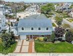 Amazing Beach Side House,  Eat in Kitchen, Dining Room, Large Living Room, Full Bath with/Tub, up to Bright Primary Bedroom w/Hardwood Floors and lots of closets, Bedroom, Bedroom, Bedroom, Full bath w/ Stall shower, Sun from every room. Beautiful deck w/Pergola sit and relax. Separate side yard. Close to Beach, and Beautiful Long Beach Boardwalk, Close to West End and wonderful stores and restaurants. Close to transportation.