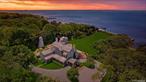 This majestic, one-of-a-kind estate is set on 4+ private, resort-like acres south of Montauk Highway. Its unique location on the southwest-facing waterfront provides incredible sunset views over Seatuck Cove and Moriches Bay from large windows throughout the bright, airy main residence. Perfect for entertaining, the meticulously updated 9-bedroom, 9.5-bath main home features a chef&rsquo;s kitchen with granite countertops, Wolf stove, dual ovens and dishwashers, and a 17-foot island. There&rsquo;s a living room with a built-in bar and wood-burning fireplace, a dining room, family room, handsome library and sunroom with wood-burning fireplaces, and a temperature-controlled wine cellar; and French doors lead to an ample patio overlooking the water. The primary bedroom has dual closets, custom built-ins, a bathroom with radiant floor and dual vanities, and a porch with sweeping water views. A former 19th century hunting lodge, the home blends old world charm with modern-day amenities, including an elevator and state-of-the-art mechanical systems, and features a porte cochere for shelter when getting in and out of vehicles. The sprawling property, which is bordered by tall perimeter trees and accessed through a gated entrance, includes a four-bedroom guest house with full kitchen; a detached five-car garage with commercial-grade hydraulic car lifts; a charming, refurbished, old-fashioned windmill; and a pool house with sauna, and gym overlooking the 45x20 heated saltwater gunite pool. A sweeping, lush lawn extends down to 234 feet of waterfront, where there are docks, a sandy beach and a boathouse. Har-tru tennis courts complete the country club experience. There&rsquo;s little reason to ever leave!, Additional information: Appearance:like new, ExterioFeatures:Tennis, Interior Features:Guest Quarters, Lr/Dr
