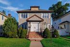 A center-hall Woodmere Colonial in Woodmere. Four bedrooms on the second level. Finished basement. Large fenced yard. Excellent location!