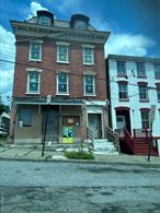 A rare opportunity to acquire a substantial brick mixed-use property on a high-visibility corner lot, this building is currently undergoing a full gut renovation from the exterior walls in. Offering over 6, 125 square feet across four levels, the property is designed to deliver both immediate income potential and long-term value for its new owner. On the street level, the building features two generous storefronts with outstanding exposure. Large windows, corner visibility, and flexible layouts make these commercial spaces ideal for retail, professional office, or service-oriented businesses. The storefronts are designed to attract tenants quickly, with updated systems and the ability to customize finishes. Above, the residential portion spans three floors. The second floor will hold two spacious 2-bedroom apartments, each designed with open layouts, ample windows, and modern amenities. On the third and fourth floors, youâ€™ll find one apartment per level, each featuring 2 bedrooms plus a dedicated office spaceâ€”a floor plan thatâ€™s especially appealing in todayâ€™s market where work-from-home lifestyles are the norm. These thoughtfully designed units will maximize rental demand and ensure strong occupancy rates. The renovation is comprehensive, incorporating modern building standards and systems throughout. Highlights include a full sprinkler system, fire escapes, and individual electric, gas, and heating systems for each unit, giving tenants autonomy and simplifying management for the owner. The exterior maintains its solid brick construction, while the interiors are being re-imagined for modern living and business use. Buyers have the unique opportunity to purchase now during the renovationâ€”perfect for someone who wants to put their own finishing touches on the projectâ€”or acquire the building once renovations are complete. This flexibility makes it ideal for investors seeking to control cost, design, and timeline. Proximity to local amenities, transportation, and community hubs further enhances its desirability for both residential and commercial tenants. Whether your goal is to hold as a long-term income-producing asset, complete the project and quickly reposition it in the market, or customize it for mixed personal and investment use, this building offers flexibility and exceptional potential. Donâ€™t miss the chance to acquire a property of this size, scope, and location with renovations already well underway.