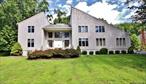 This well-located property is truly special and one of a kind! It is characterized by its well-maintained, sizable contemporary style home along with the tranquil, private park-like land that it is set on. It will captivate your heart and be a vision for what you and your family can grow into. The house is open, warm and bright. It has 4 bedrooms, 2.5 baths and plenty of square footage. Be welcomed through the front door into its inviting and spacious entry. Step down into the living room and see and feel its grandeur. Appreciate the vaulted ceiling, skylights, hardwood flooring and the two sided wood-burning fireplace. The living room and the kitchen are spaces that your family and friends will love gathering in, to celebrate holidays and special occasions. Remodeled 5 years ago, the kitchen offers plenty of cabinets, a large island, a double oven and an eat-in area. Enjoy the deck, overlooking the patio and serene yard and how it joins the kitchen and living room areas. Complementing the remainder of the first floor is a comfy TV room, a separate study, a formal dining room, a convenient powder room and a functional laundry area. Creating an additional bedroom on the first floor is also possible in the office or TV room. The second floor has a large primary suite, with a bedroom, ample closet space and a full bath that has two vanities, a jacuzzi tub and a standing shower. The rest of the top floor has an additional full bath and 3 bedrooms. One of the bedrooms was recently used as an artist&rsquo;s studio but can be used as a media room or additional office. There is a 2-car garage and a full basement, ideal for storage or to finish. Note the lower taxes compared to other homes in the area. The home is a 15 minute drive to Beacon&rsquo;s vibrant Main Street where shops, galleries, restaurants, music venues, a movie theater and coffee shops can be enjoyed. The charming Main Streets of the Village of Fishkill and Wappingers are within 10 minutes. Fall in love with the mountain and river parks that abound the area. The house is also minutes to the Beacon and New Hamburg Metro-North train stations, along with Rte 9 and I-84, making commuting and travel outside of the region very easy. This is a great opportunity to own in a well-located and adored area within the Hudson Valley&rsquo;s Southern Dutchess County!