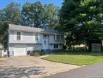 Beautiful, spacious Hi Ranch in Miller Place School district! Features 3 bedrooms, living room, dining room, kitchen and full bath on main level with hardwood floors. Lower level features bedroom, den and full bath. 1 car garage and fully fenced yard on dead end st!!