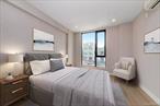 Step into Unit 6C at Polaris Condominiumâ€”a sun-drenched, move-in ready 2-bedroom, 1-bathroom home where modern design meets effortless comfort and breathtaking city views. Enjoy hardwood floors throughout, oversized windows in both bedrooms, and a private balcony offering stunning panoramas of Manhattan and Queens. The open-concept layout is complemented by a custom Mitsubishi heating, cooling, and humidity control system in every room, while the chefâ€™s kitchen features a built-in grill stove, high-performance digital vent, stainless steel refrigerator and dishwasher, and a sleek designer faucet. The spa-inspired bathroom is outfitted with floor-to-ceiling tiles, a deep soaking tub, LED mirror with touch-adjustable lighting, and built-in storage for a clean, sophisticated look. Both bedrooms offer custom-designed closets for efficient and stylish storage. Polaris Condominium delivers premium amenities including an elevator, rooftop deck with sweeping city views, private underground parking with remote-controlled gate, bicycle storage, virtual doorman, CCTV security, and an intercom systemâ€”all in a mixed-use building with an on-site beauty salon and physical therapy office. Located on vibrant Northern Blvd near shops, supermarkets, dining, and public transportationâ€”with easy access to the Grand Central Parkwayâ€”this residence combines convenience, comfort, and low common charges .Donâ€™t miss your chance to own this modern sanctuary in the heart of Queens!