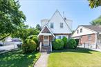Welcome to this beautifully maintained Tudor Colonial, blending timeless character with thoughtful updates. The home features 3 comfortable bedrooms and 2 full baths, a bright living room, a welcoming formal dining room, and an updated eat-in kitchen designed for everyday living and entertaining. The finished basement provides additional space, ideal for a family room, home office, or playroom. Located in the heart of Bellerose, this home is close to schools, shopping, parks, and transportation, offering convenience and comfort in one. Move-in ready and meticulously cared for, this home is truly a must-see!