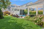 Contemporary Coastal Bayfront Retreat over-looking bird sanctuary. Personal Marina. 2 boat lifts. One in-water slip. Jet-ski lift. One davit. Floating Dock. Swimming Pool 8 ft deep end diving board. Hot tub with waterfall overflow. Gazebo. Custom fire pit. Outdoor/Indoor Sonos Sound System. Pergola Dining Deck with open air Kitchen flows indoors to custom built gourmet kitchen featuring high end appliances. Double oven + warming drawer. Pot filler. Granite Island barstool seating flows into dining room and living room for seamless entertaining. Billiard room. Built in bar. Office area. Juliet balcony. Primary Suite private deck with Pergola. Four Levels of Luxury Living space with dedicated bedroom and bath on each level. Elevator. Three car garage with pass through for easy water access. Epoxy flooring. Workshop. Above ground basement for plenty of storage space. FEMA Compliant.