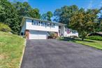 Welcome to this beautifully maintained split-level home located in the heart of south side Poughkeepsie. Located on a quiet street close to RT 9, shopping, colleges, hospitals, and all of what the Hudson Valley has to offer. First time on the market since this house was built, this home has been meticulously cared for. This home offers 4 spacious bedrooms, primary bedroom features updated ensuite, followed by a second renovated full bathroom, 2 half baths, hardwood floors throughout most of the living areas, and plenty of space for entertaining. Enter the charming eat-in-kitchen featuring updated cabinets, paint, ample counter space and storage, and first floor laundry for convenience. Enjoy the formal living area with lots of natural light, formal dining area for hosting or gatherings, followed by a large and updated family room downstairs with new carpet throughout, a fireplace, and access to the covered porch and private backyard.Additional highlights include a newer roof installed 2018, water heater 2020, driveway paved and sealed 2021, and a reverse osmosis water filteration system installed 2022.Come see this beautiful house today and make it your home!