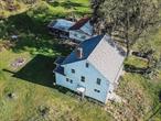 Welcome to 1308 Route 302, Bullville, NY! This 3-bed, 1.5-bath, 1, 506 sq ft home, built in 1942 and renovated in 2023, blends classic charm with modern updates. It features 6 rooms, carpet and hardwood floors, hot air heating, and a full basement for storage or future use. Set on a 2.3-acre lot, it offers ample space for outdoor activities and gardening. A detached garage provides parking and storage. Located in the Pine Bush School District, it balances rural peace with easy access to amenities. A great opportunity to own a piece of Bullville!