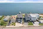 Gorgeous & Spacious Bay Front Colonial- You&rsquo;ll Never Want To Leave Home. 4 Bedrooms, 2.5 Baths. 9 Ft. Ceilings, Hardwood Floors. Pristine Eat-In-Kitchen & Grand Living Room W/ Sparkling Views of the Bay. Boat lift, Mooring Poles and 50ft Pier. 12, 000 lb lift Hold up to 26 Ft. Boat, 9.6ft Beam
