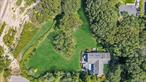 Million-dollar views await at this rare Sound Beach location, featuring TWO adjacent lots totaling 0.77 acres with unobstructed views of the Long Island Sound and Connecticut shoreline. This 3-bedroom, 3-bath raised ranch includes a sun-filled living room with a wood-burning fireplace, hardwood floors, Andersen windows, and sliding glass doors opening to a spacious tri-level deck. The eat-in kitchen and dining area showcase sweeping water views, while vaulted ceilings and skylights fill the home with natural light. Additional highlights include a walk-out basement with full bath and versatile living space, a 1-car garage, and beautifully landscaped park-like grounds that create your own private oasis. Owners have the option to join the Sound Beach Property Owners Association, providing exclusive access to a secluded private beach.