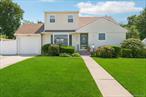 Welcome to this expanded Cape located on a picturesque street within the West Babylon School District. This versatile home is perfect for a growing household or those seeking the benefit of a legal two-family setup with proper permits.The main level features hardwood floors, a spacious eat-in kitchen, and a bright open layout ideal for everyday living. The newly updated kitchen boasts quartz countertops, a glass subway tile backsplash, stainless steel appliances, luxury vinyl wood flooring, and a brand-new pantry for excellent storage. A partially finished basement offers additional flexible space, while the large deck and expansive yard provide the perfect backdrop for outdoor entertaining.Recent upgrades include a 5-year-old roof, a newly installed 7-zone front-and-back sprinkler system, and 200-amp electric service. A long driveway and attached garage add convenience and parking options.The second floor offers a generous one-bedroom apartment with its own permit, providing an ideal income opportunity. For those who donâ€™t need the rental, the space can be converted into 2 additional bedroomsâ€”bringing the home to a total of five.