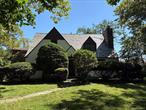 Timeless English Tudor In The Heart of Little Neck Hills. Offering A Blend of Elegance And Comfort. Stepping Into An Oversized Living Room With Wood Burning Fireplace. Large Formal Dining Room, Hardwood Floors Throughout. Large Eat In Kitchen With Vaulted Ceiling. Colossal Master Bedroom with Wood Burning Fireplace. Three More Bedrooms Plus Office And Den/Study. Two Full Baths And One Half. Large Covered, Patio. School District 26 ,  Close To All.