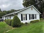 Beautiful sunny & bright Hampton end unit, with many updates. The Country Kitchen and breakfast nookare lit up with a large skyligh, from there toulook at a secluded area of bushes and trees. The Primary Bedroom has a private bath, and both bathrooms have been updated. Skylights fill the rooms with natural light and a warm homey feel. There is New vinyl flooring throughout with new moldings and doors. There is crown molding throughtout. There is a Very Long driveway with a New garage door and a garage floor coaribng and sealer. Also a pull down attic stairs with some flooring for extra storage. The AC unit is from 2023, and a 50 gallon hot water heater from 2020. There are beautiful shrubs and bushes surrounding the Condo. All maintenance outside the sheetrock is taken care of through Low HOA fees. Lesidure Village is an active community with many clubs, clubhouse, gated and patroled 24 hr security, snow removal, lawn care, 1 pet policy 25 lbs max. 1 car per person, high speed internet included in common fee with cablevision