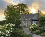 Charming farmhouse, built in 1860, thoughtfully modernized for comfortable indoorâ€“outdoor living. Set on 5 picturesque acres, the property features an original barn and a natural spring-fed pond, creating a serene country setting.The first floor offers a light-filled, open-plan kitchen and living room anchored by a large wood-burning fireplace. French doors open to a stone terrace and pergola, perfect for outdoor dining and relaxed entertaining.Upstairs, youâ€™ll find three inviting bedrooms, an upstairs living room with a gas fireplace, and French doors leading to a second stone terrace. A cozy â€œsunset porchâ€ captures sweeping western views of the Catskillsâ€”an ideal spot to unwind at the end of the day.Located just 5 minutes from the Hawthorne Valley Farm Store, 15 minutes from Chatham and Hillsdale, and 25 minutes from both Hudson and Great Barrington. Only 20 minutes to Catamount and other Berkshire ski areas. In addition, there are three conveniently located private schools : Hawthorne Valley Waldorf School, Darrow School, and Woodland Hill Montessori School.Lawn and landscape care, snow plowing, and the dedicated attention of long-standing property caretakers are included, ensuring the homeâ€™s upkeep.