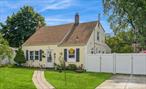 Welcome to this beautiful turn-key expanded Cape, tucked away on a quiet dead-end street in Westbury. Sitting on a 60X100 lot, this 4-bedroom, 2-bath home was updated just a few years ago, blending comfort, style, and functionality in a spacious layout ideal for both everyday living and extended family needs. The main floor features a bright living room with a beam ceiling for added character, an eat-in kitchen with marble countertops and updated appliances, and a large family room at the back with direct access to the yard perfect for gatherings and relaxation. Two bedrooms and a full bath complete the first level. Upstairs, youâ€™ll find two additional bedrooms and a second full bath with Laundry access for added convenience. Step outside to a nice-sized backyard, perfect for entertaining, gardening, or play. Additional highlights include a private driveway, interior and exterior security cameras and a convenient location close to schools, shopping, the LIRR, and major highways. Donâ€™t miss your chance to own this move-in ready expanded Cape offering updates, space, and a prime Westbury location! Not to mention low taxes!