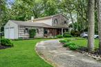 Expanded Colonial with Huge Family Room with Propane Gas Fireplace/Laundry room Conveniently Located on 1st Floor/Hardwood Floors/Entertaining Wood Rear Deck/ 3 Generous Bedrooms and 2.5 Baths plus 2 Car Garage/200 Amp Electric with Transfer Switch/Large Primary Bedroom with Bathroom/Closets and Fireplace/ Great Smithtown Schools and MORE !