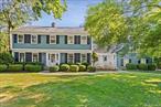 Traditional Classic Elegance! Fabulous curb appeal and total privacy just 5 minutes to downtown Ridgefield. Meticulously maintained by the current owner for almost 50 years. This is the home that everybody wants but never comes on the market. Styled for convenient living and entertaining; large in ground pool with pool house/changing room/storage room with water and electricity, oversized custom deck overlooking level property surrounded by woods with custom landscaping, including flowering trees, shrubs, and gardens Formal dining room with wainscoting, sunken step down living room with a fireplace, a library/den with a fireplace, updated kitchen with granite counter tops and custom limed oak cabinets and dining area with French Sliding Doors to the custom deck, powder room. Roomy laundry in mudroom with front door to small portico and rear door to deck. Tremendous family room over garage, complete with wet bar and attached full bath. 2 car oversized garage and plenty of driveway parking. Primary bedroom with updated bath and the biggest walk-in closet you have to love. Three additional bedrooms with generous closet space and hall bath complete the second level. Oak Hardwood Floors throughout first and second levels. Whole house generator included with 250 gallon propane tank. STAR tax credit will be applied for qualified buyers. Additional Information: Parking 2 Car Oversized Attached Garage plus additional spaces in driveway.