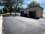 Free Standing Two Car Garage with Side Entrance. Great spot for any tradesman that needs to store vehicles and supplies. Room in garage can be used as office or as storage room. Recently installed retaining wall and black top driveway giving you your own private area. If you are a car enthusiast who needs a little more room to store and work on your cars or a tradesman looking to set up your business, this is the spot for you.